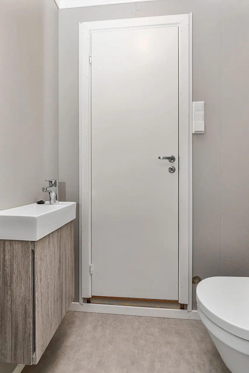 Spa-style porcelain tile bathroom with a glass shower