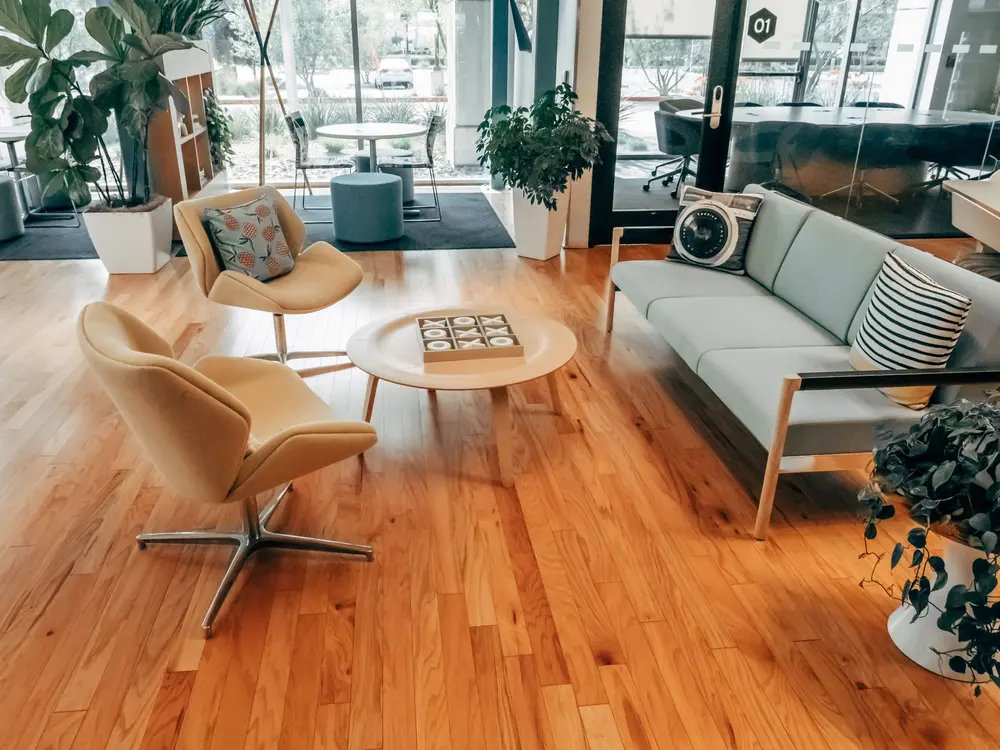 Commercial luxury vinyl flooring in a bright Orange County office lounge