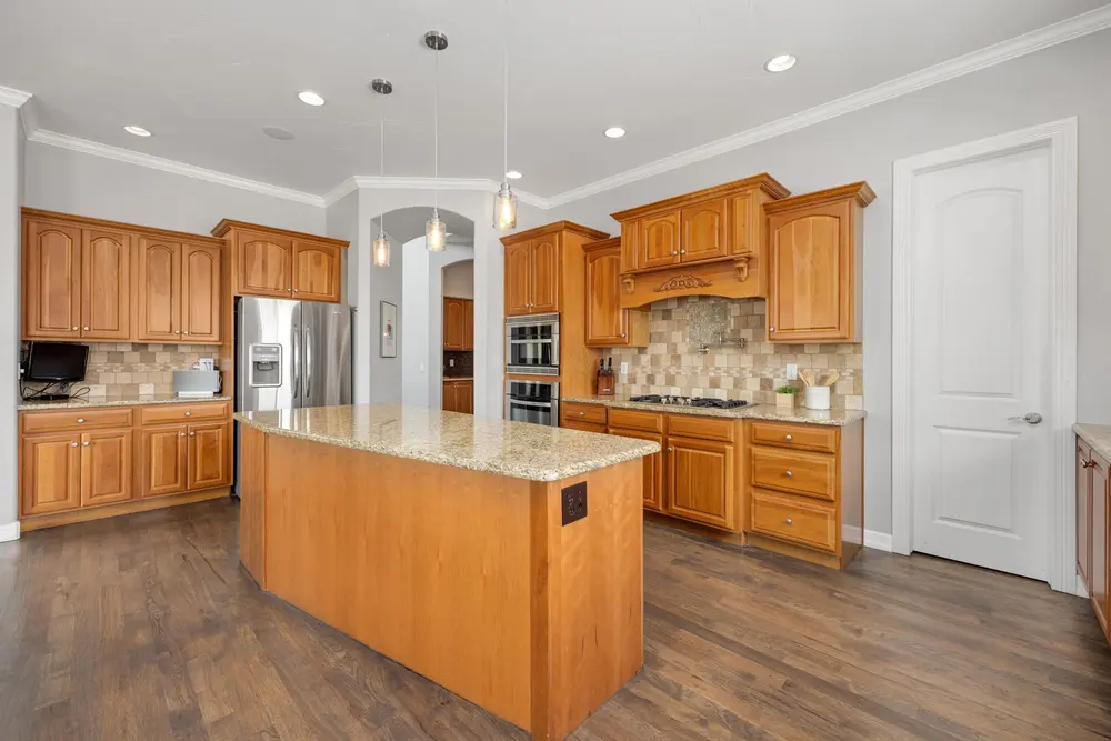 Kitchen — bright granite island — flooring installed near Stanton, CA