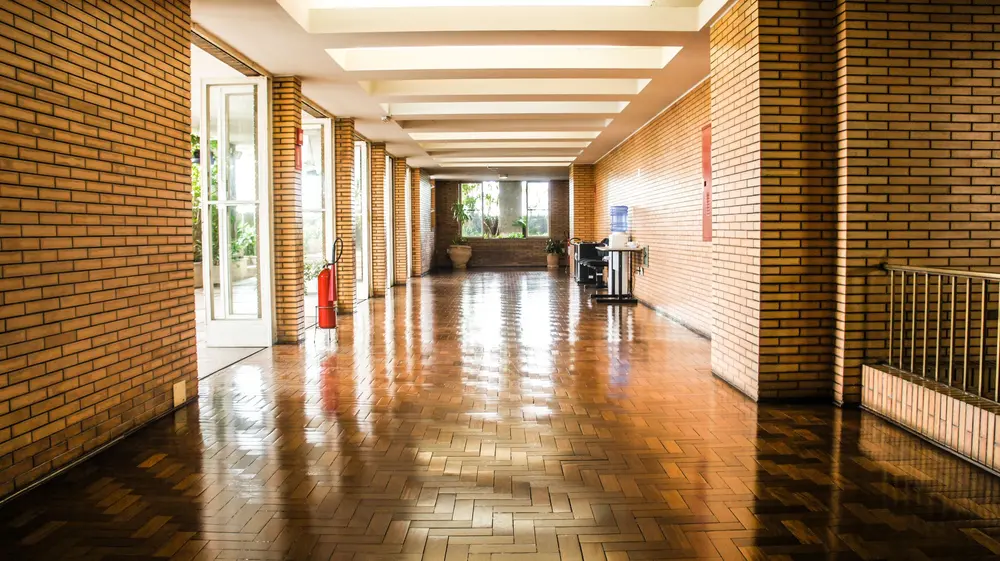 Refinished hardwood flooring — empty brick corridor s o paulo polished — Hardwood Floor Refinishing by OC Floor Guy