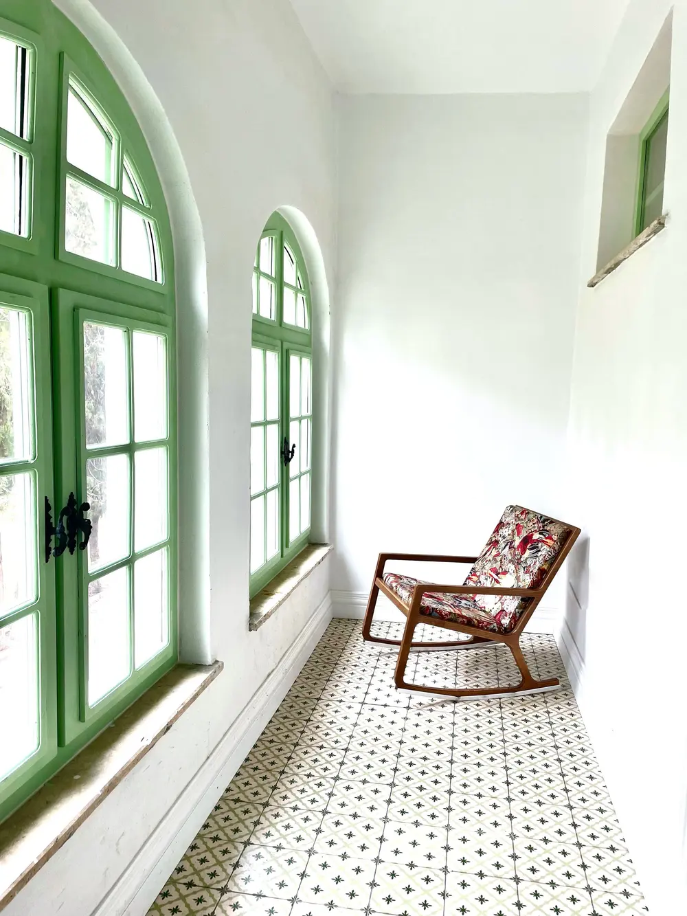 Tile flooring — bright corridor green arched windows patterned